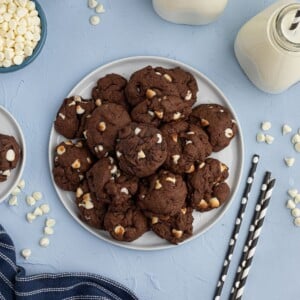 Chocolate Cookies with white baking chips, stacked on a plate. Chewy and moist air fryer cookies.