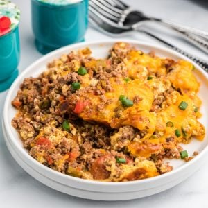 Keto friendly taco casserole made in the air fryer and served on a white plate.