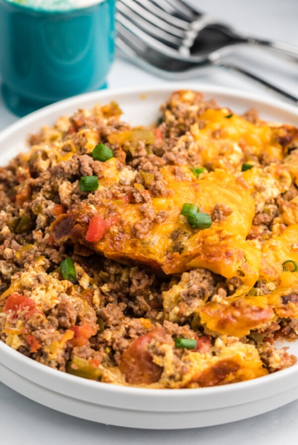 Keto friendly taco casserole made in the air fryer and served on a white plate.