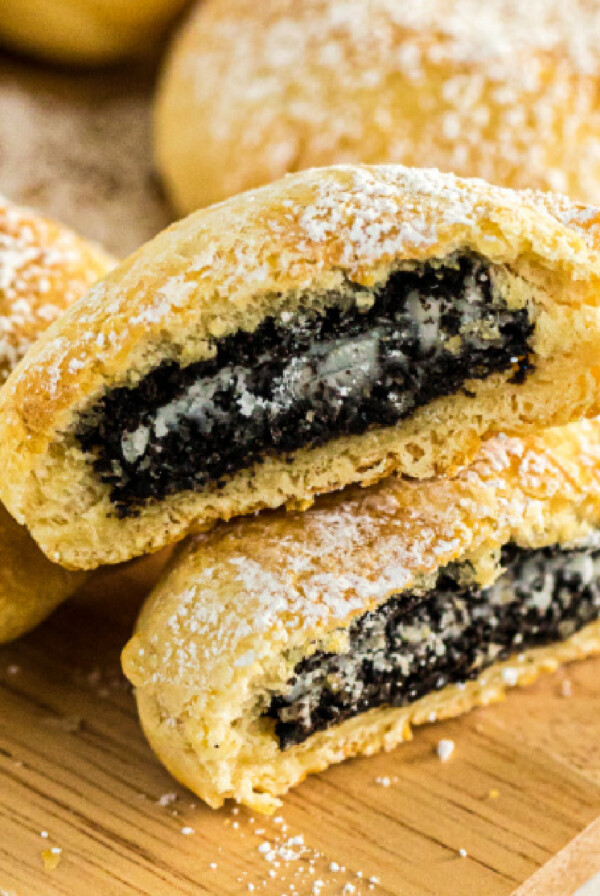 Air Fryer Oreos on a cutting board and sprinkled with powdered sugar