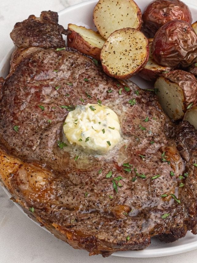 ribeye steak with a dollop of butter on the top.