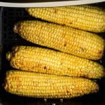 Air fryer corn on the cob fully cooked and ready to serve.