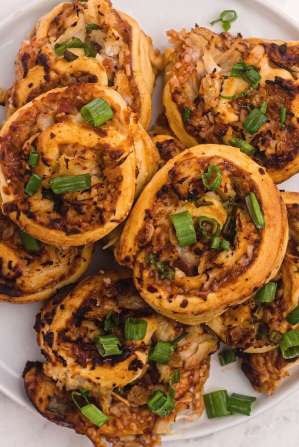 Golden bbq bites with chicken, mozzarella cheese, and topped with green onions.