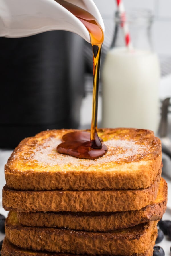 Syrup being poured on a stack of Air Fryer French Toast.