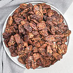 Air fried candied pecans in a bowl, ready to serve.