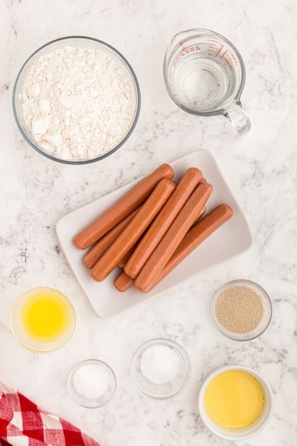 Ingredients showing what is needed to make air fryer pretzels dogs
