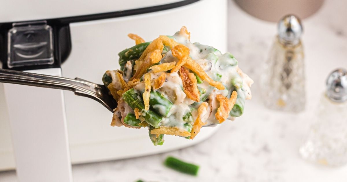 Air Fryer Green Bean Casserole is an easy holiday side dish. Made with crispy onions, cream of mushroom soup, green beans, and more.