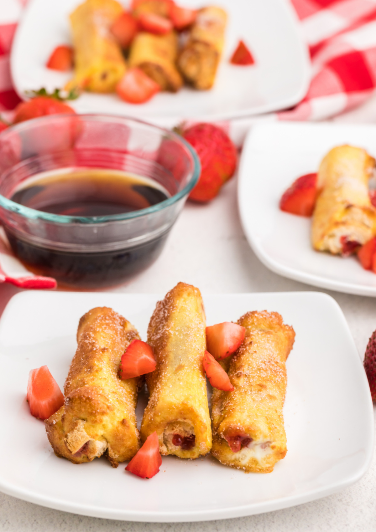 French toast roll-ups made in the air fryer and served on a plate.