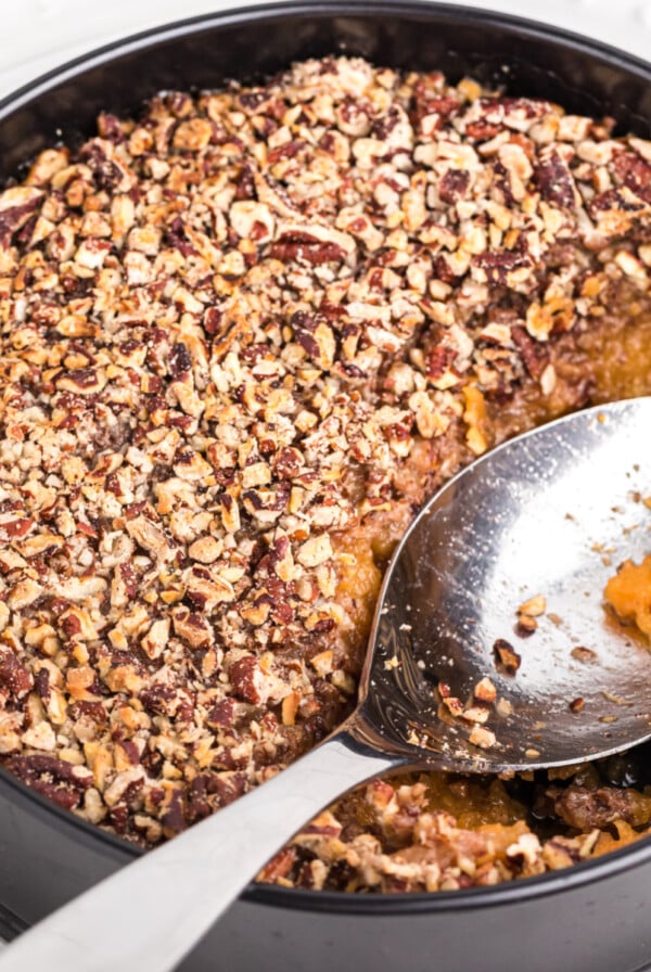 Air Fryer Sweet Potato Casserole with a scoop missing.