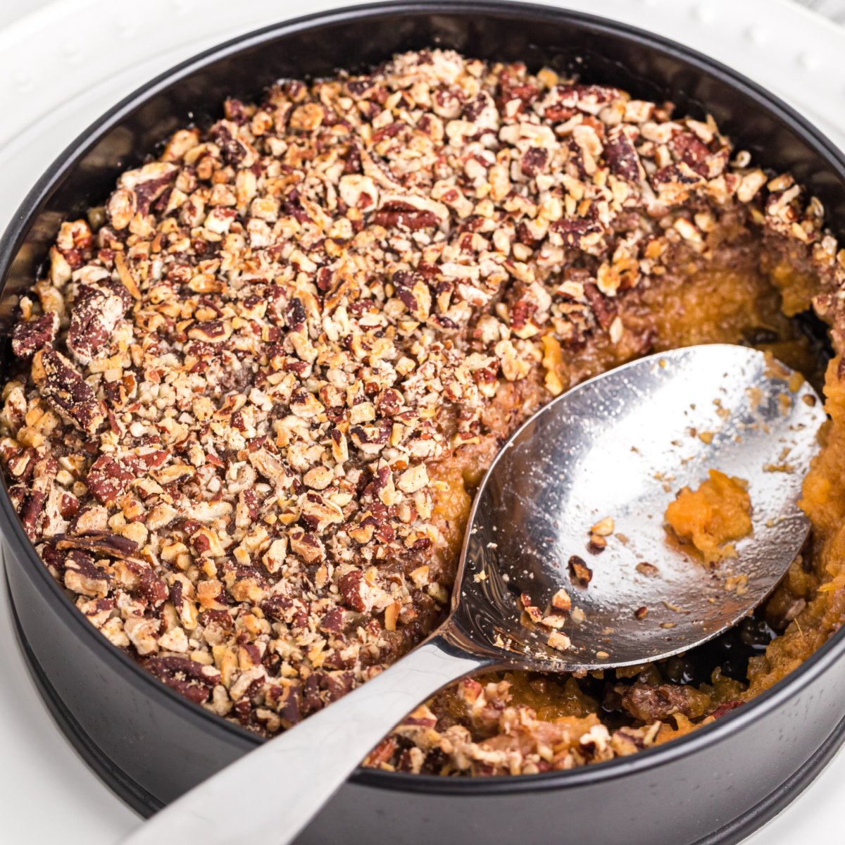 Air Fryer Sweet Potato Casserole with a scoop missing.