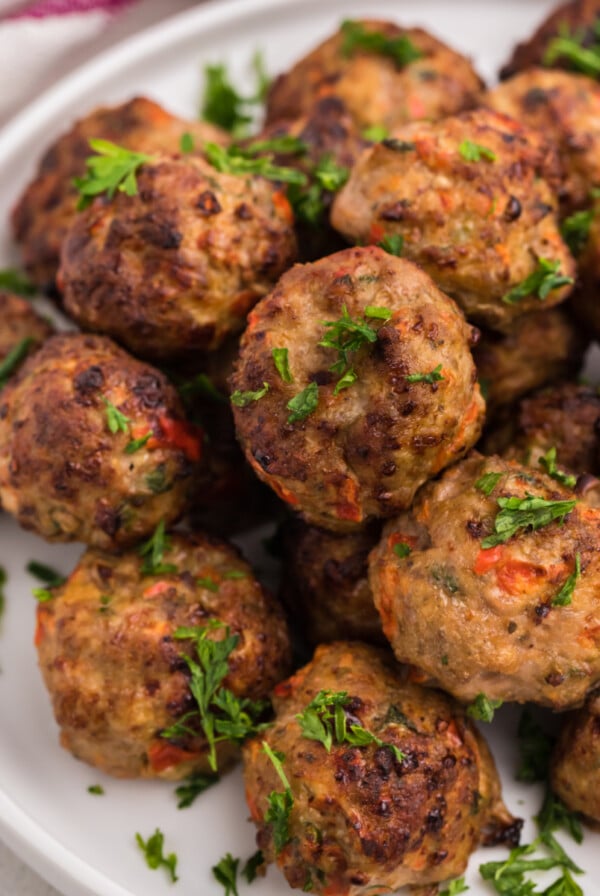 Air Fried Turkey meatballs garnished with fresh parsley.