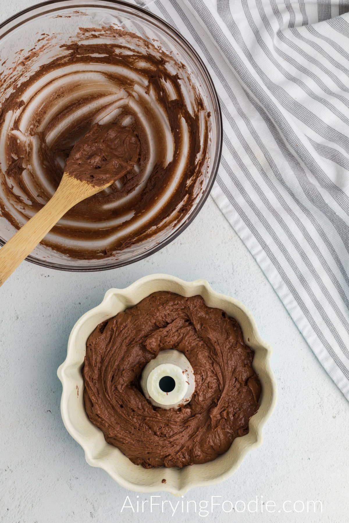 Chocolate cake batter added to the bundt pan.