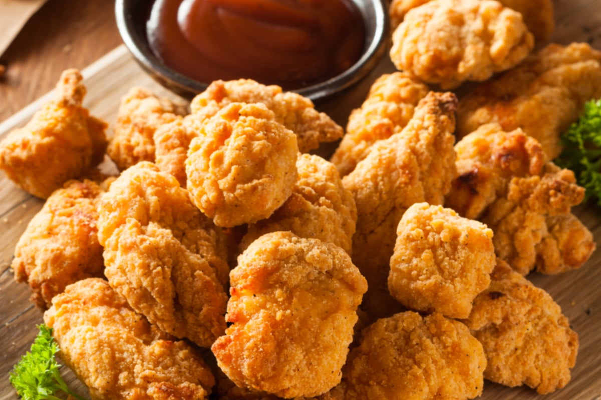 Crispy Chicken Bites on a cutting board ready to eat. 