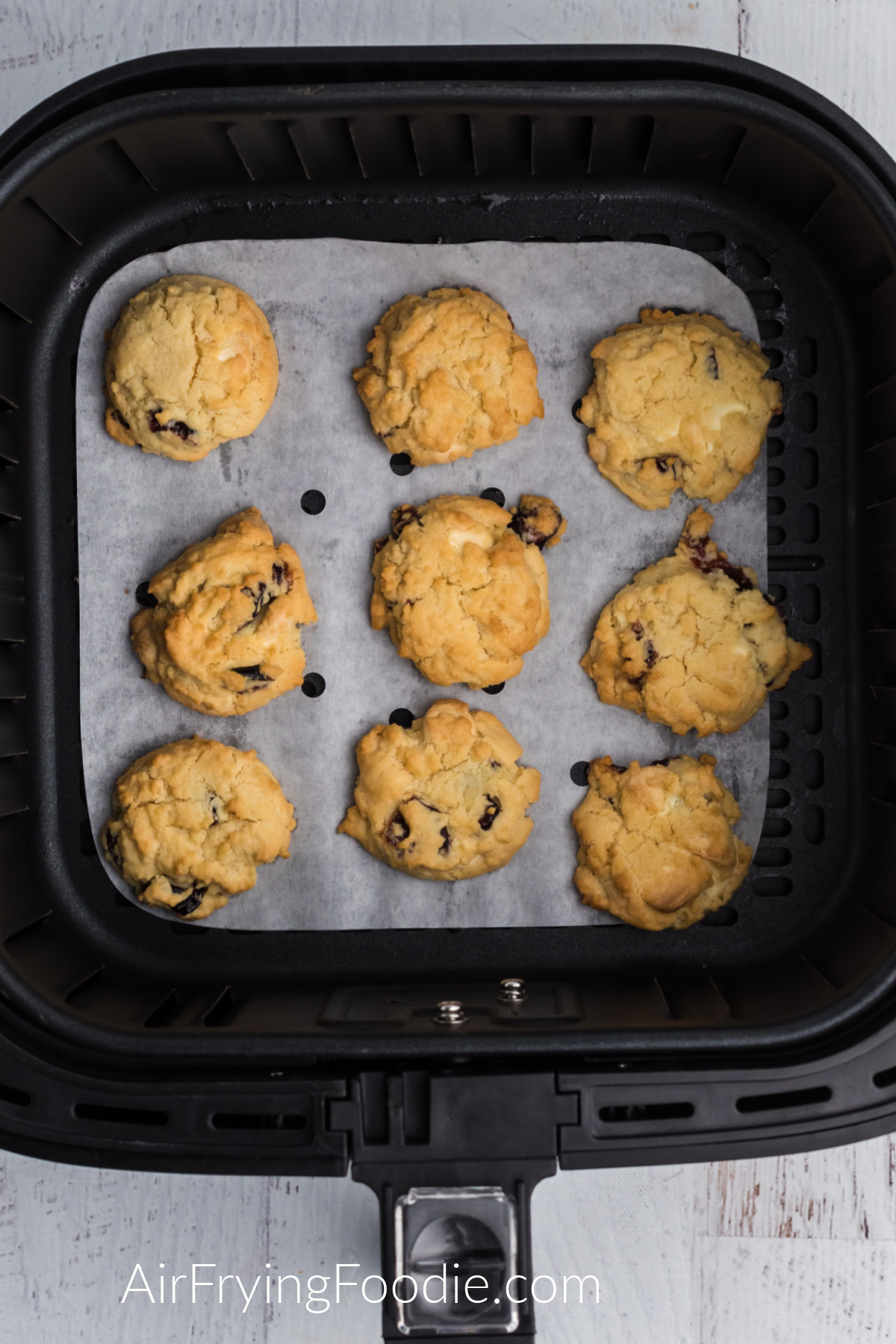 Cranberry White Chocolate Chip Cookies baked in the air fryer and in the basket.
