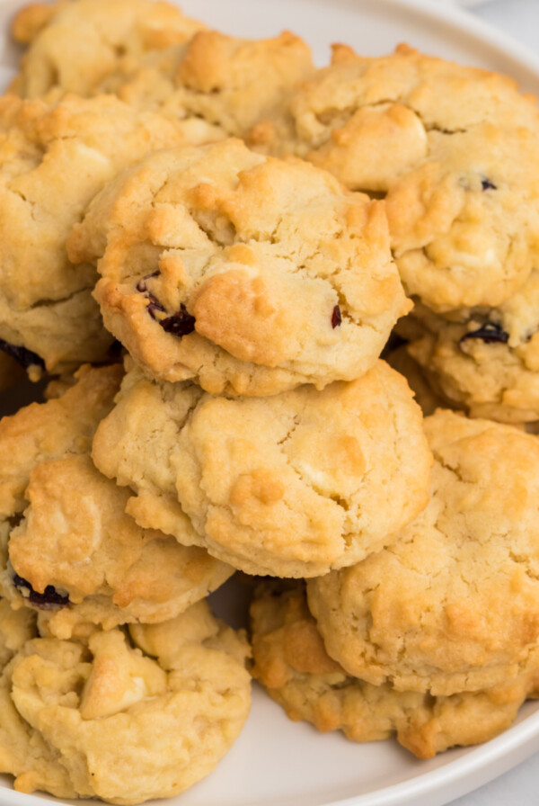 Overhead photo of cranberry white chocolate chip cookies that were made in the air fryer and served on a white plate.