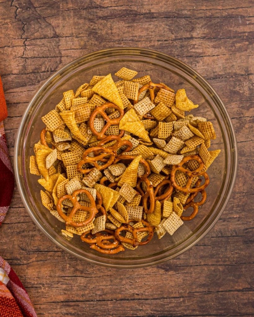 Bowl filled with cereals, pretzels, and bugles before being added to air fryer. 