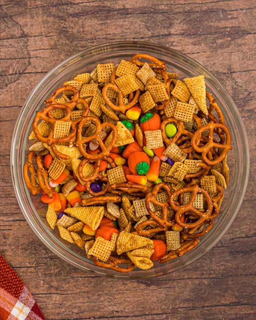 Chex Mix after being cooked, and then Halloween candies added and stirred in. 