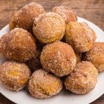 Golden donut holes covered in sugar and pumpkin spice