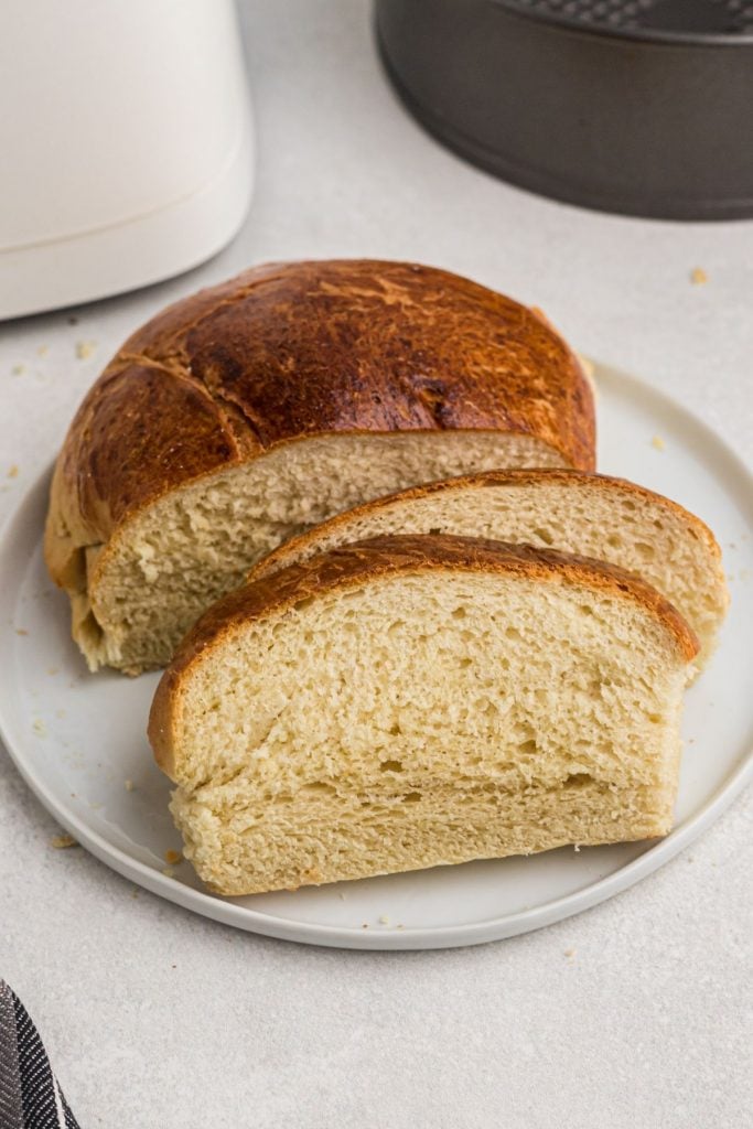 Air fryer bread sliced and baked with a golden crust