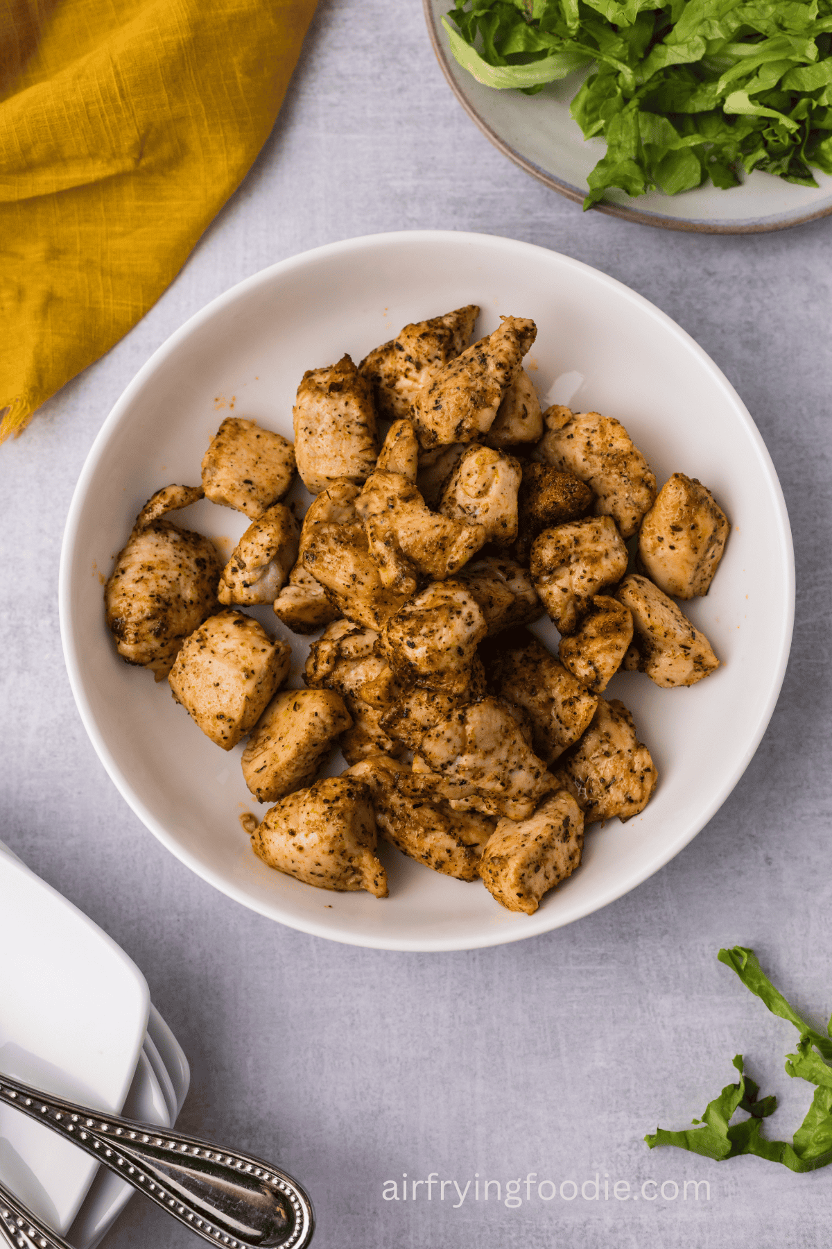 Juicy air fryer chicken bites served in a bowl. 