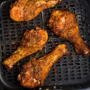 air fryr chicken drumsticks in the basket of the air fryer.