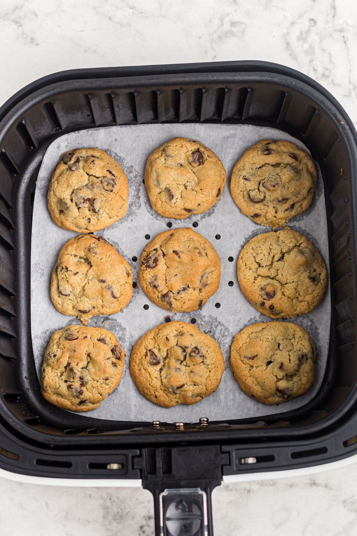 Cookies in the air fryer basket after being cooked