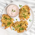 Latkes made in the air fryer on a serving plate.