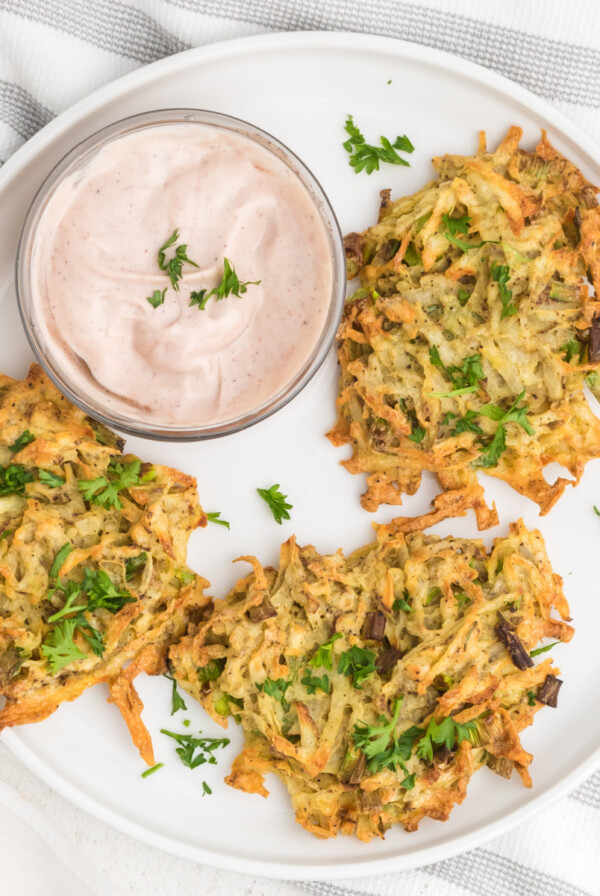 Latkes made in the air fryer on a serving plate.