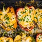 stuffed bell peppers in the basket of the air fryer.