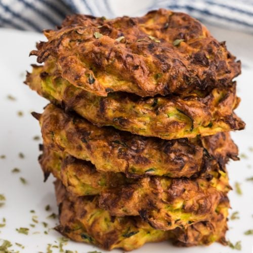 Close up of stacked crispy air fryer zucchini fritters.