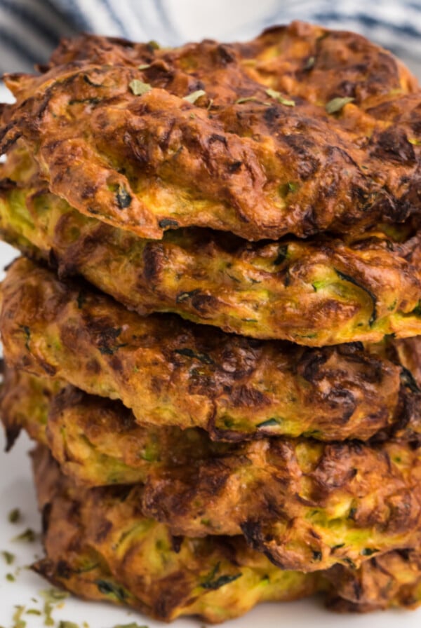 Close up of stacked crispy air fryer zucchini fritters.