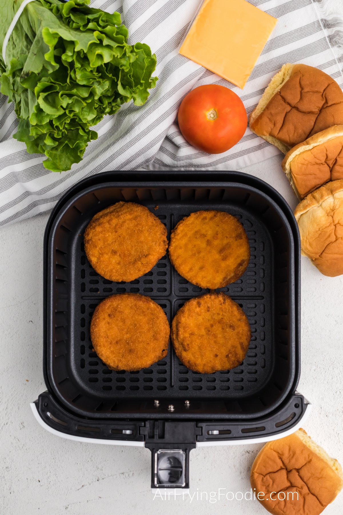 Ingredients needed to make frozen chicken patties in the air fryer into sandwiches. 