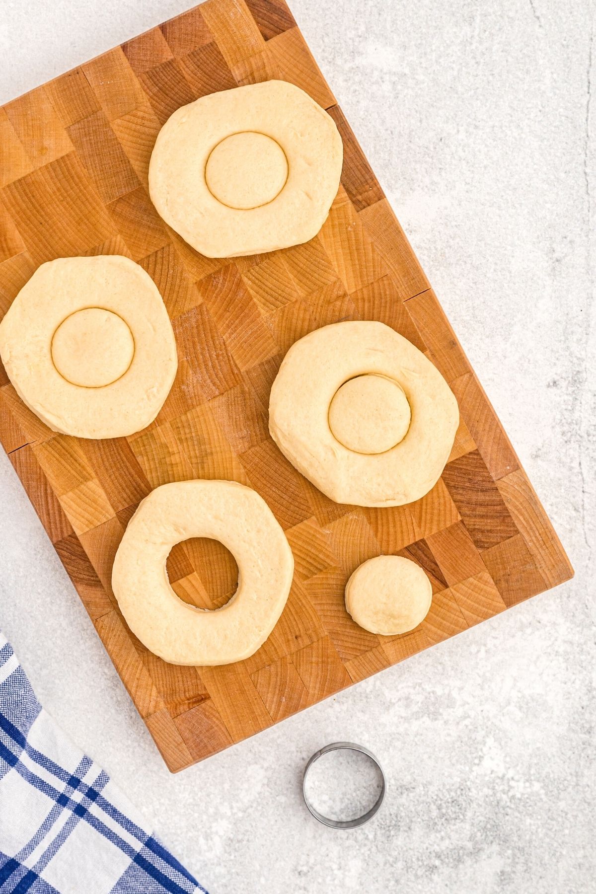 biscuits with center being cut with circles removed from centers.