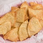 Golden crispy tortilla chips in a basket