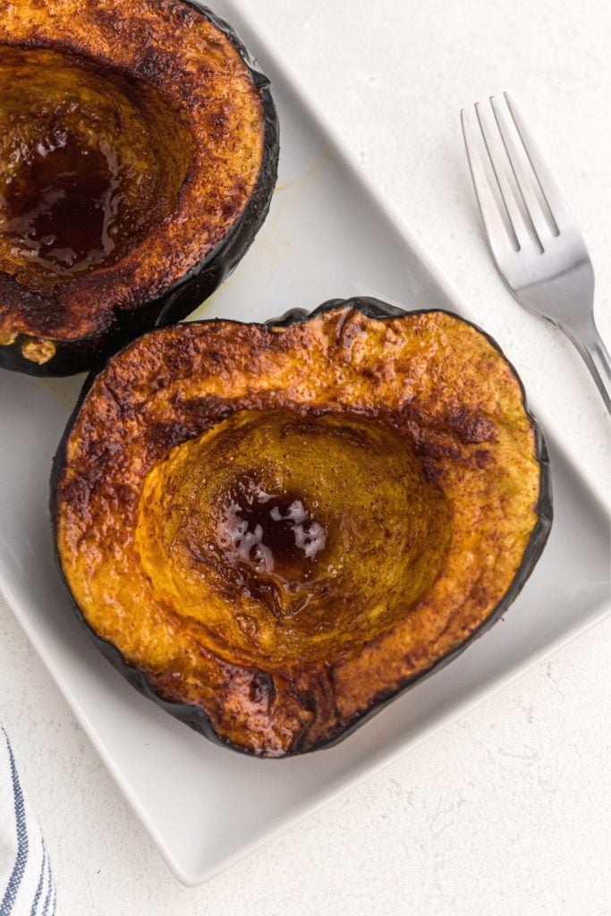 Golden brown and juicy acorn squash with brown sugar glaze melted on top
