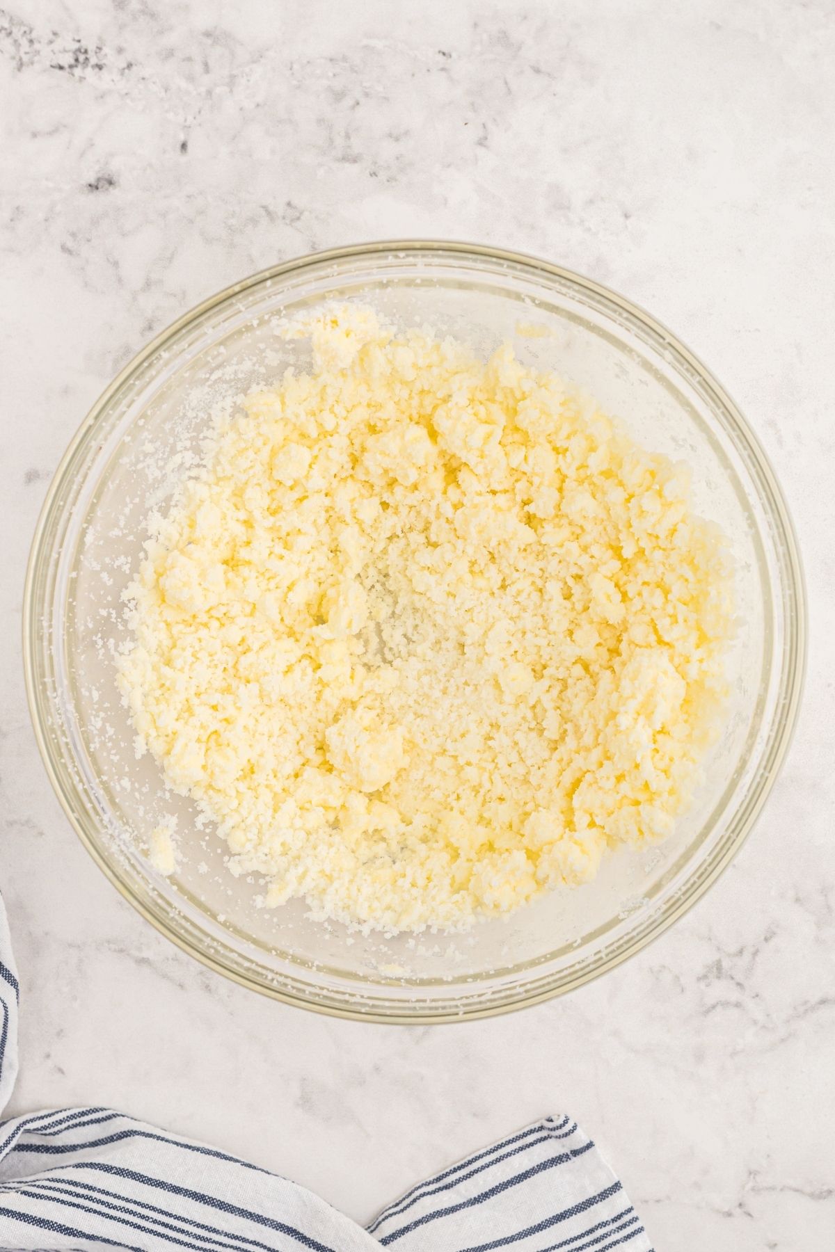 Butter and sugar creamed together in a mixing bowl
