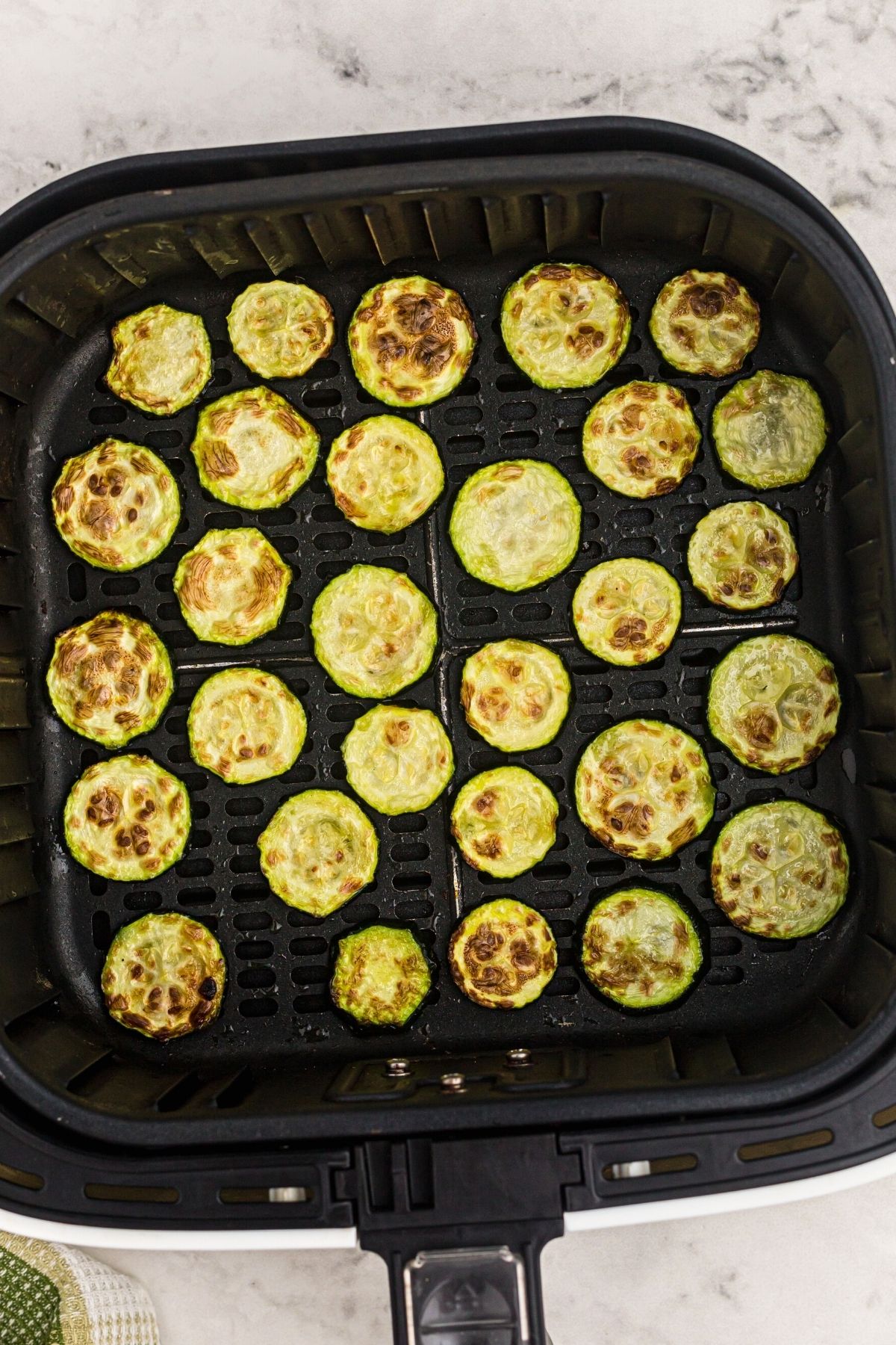 Air fryer zucchini cooked in the basket