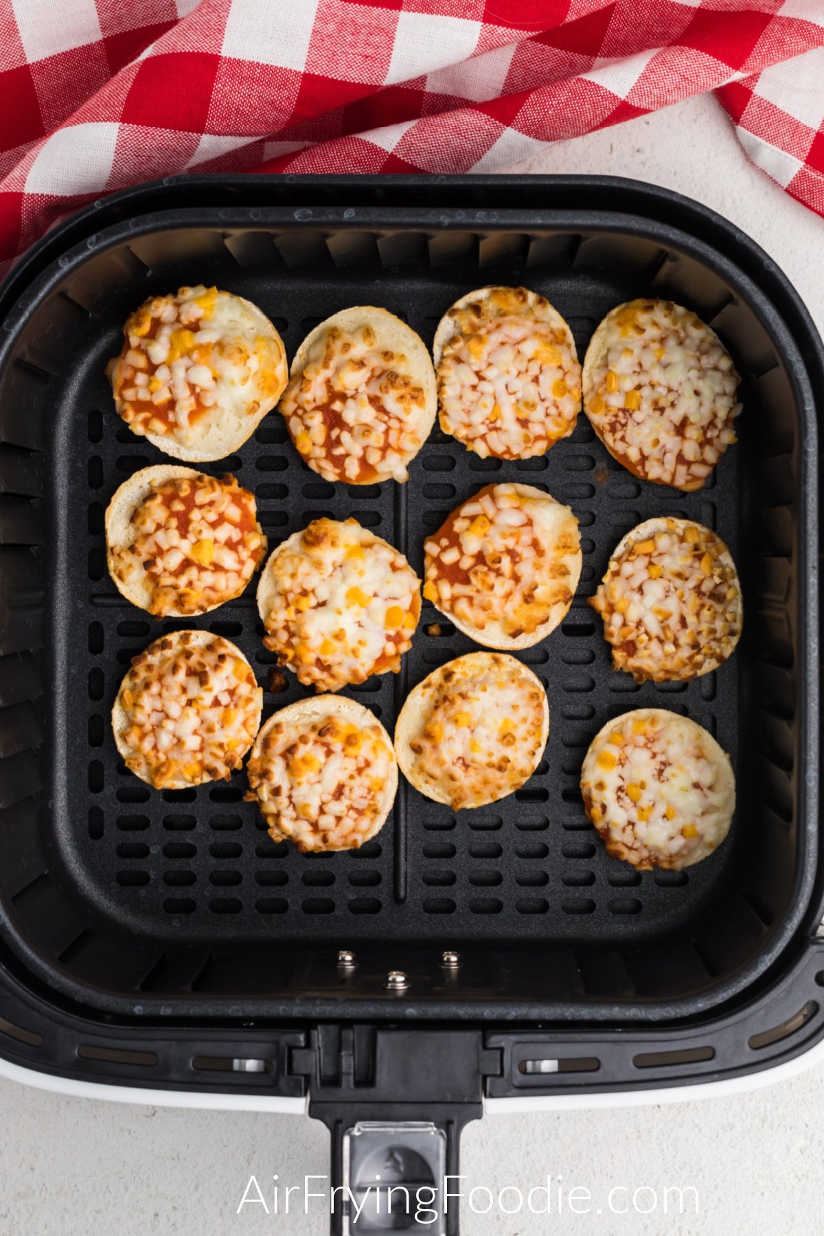 Air Fried Bagel bites in the basket of the air fryer.