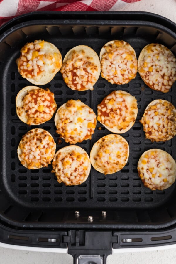 Bagel bites in the basket of the air fryer - cooked and ready to eat.