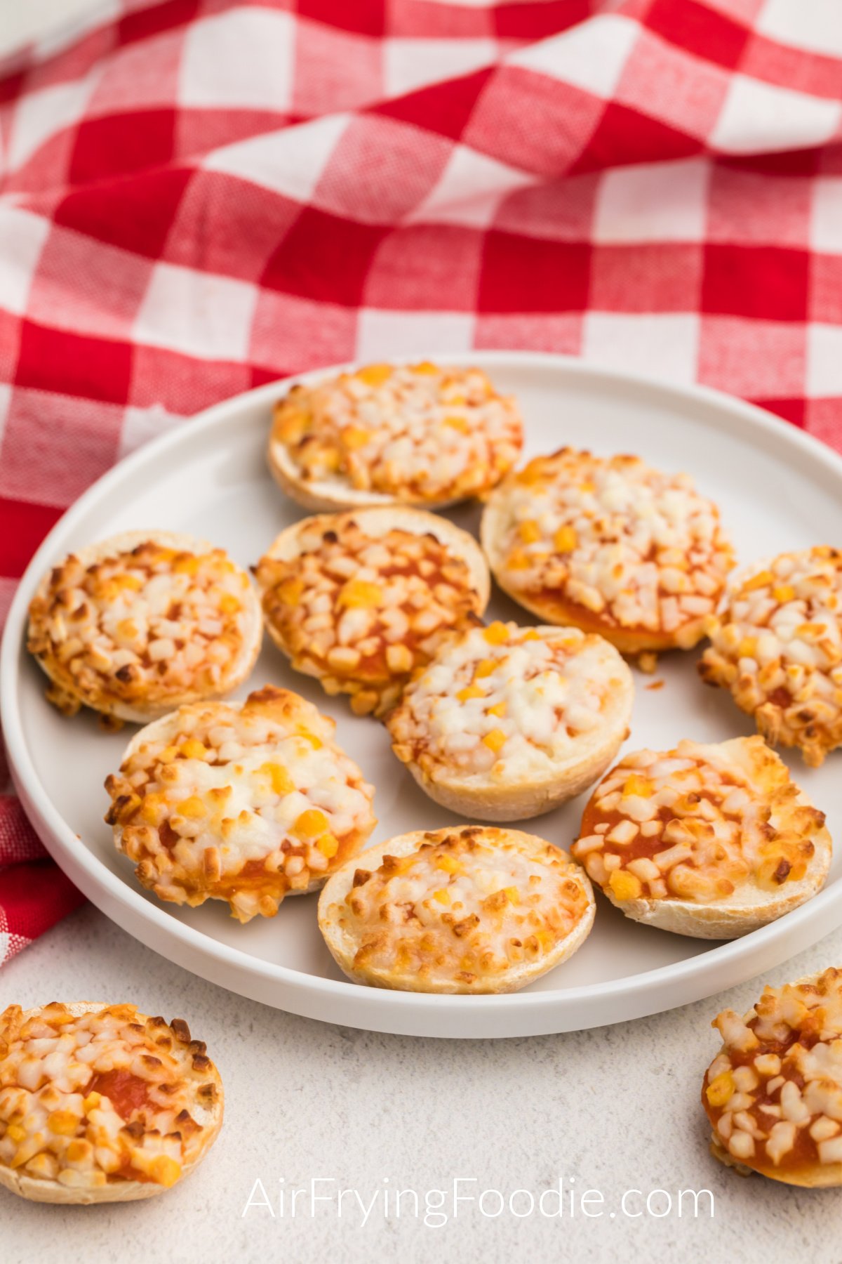 Bagel bites made in the air fryer being served on a white plate. 