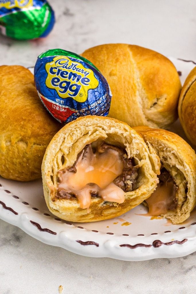 Closeup photo of air fried cadbury egg with crispy golden dough surrounding chocolate egg. 
