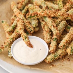 Air Fryer Green Bean Fries with dipping sauce, ready to eat.