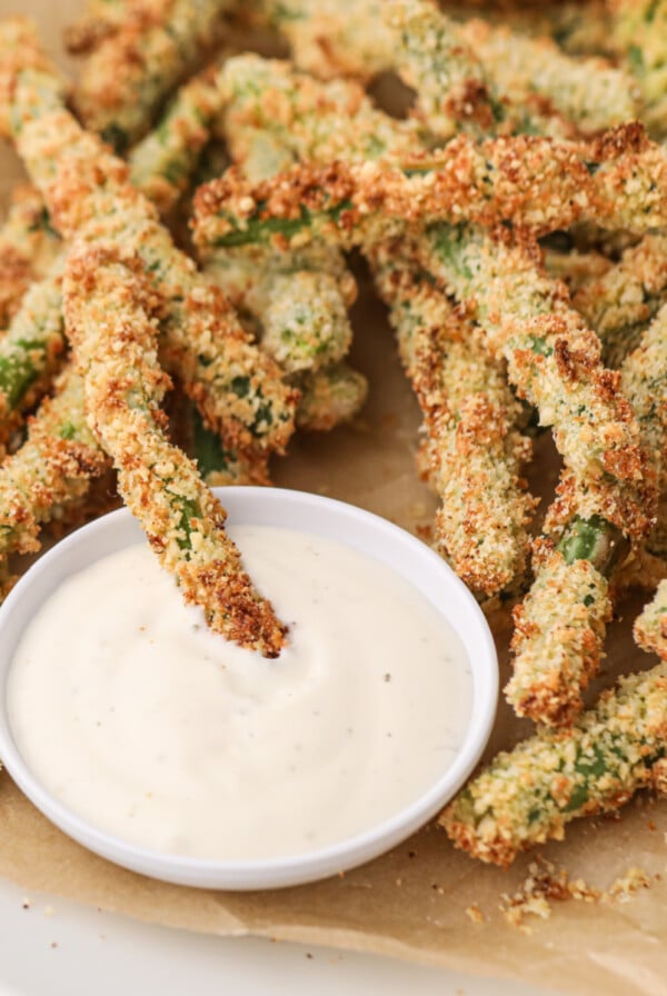 Air Fryer Green Bean Fries with dipping sauce, ready to eat.