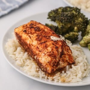 Seasoned cooked filet on a bed of rice after being cooked in the air fryer