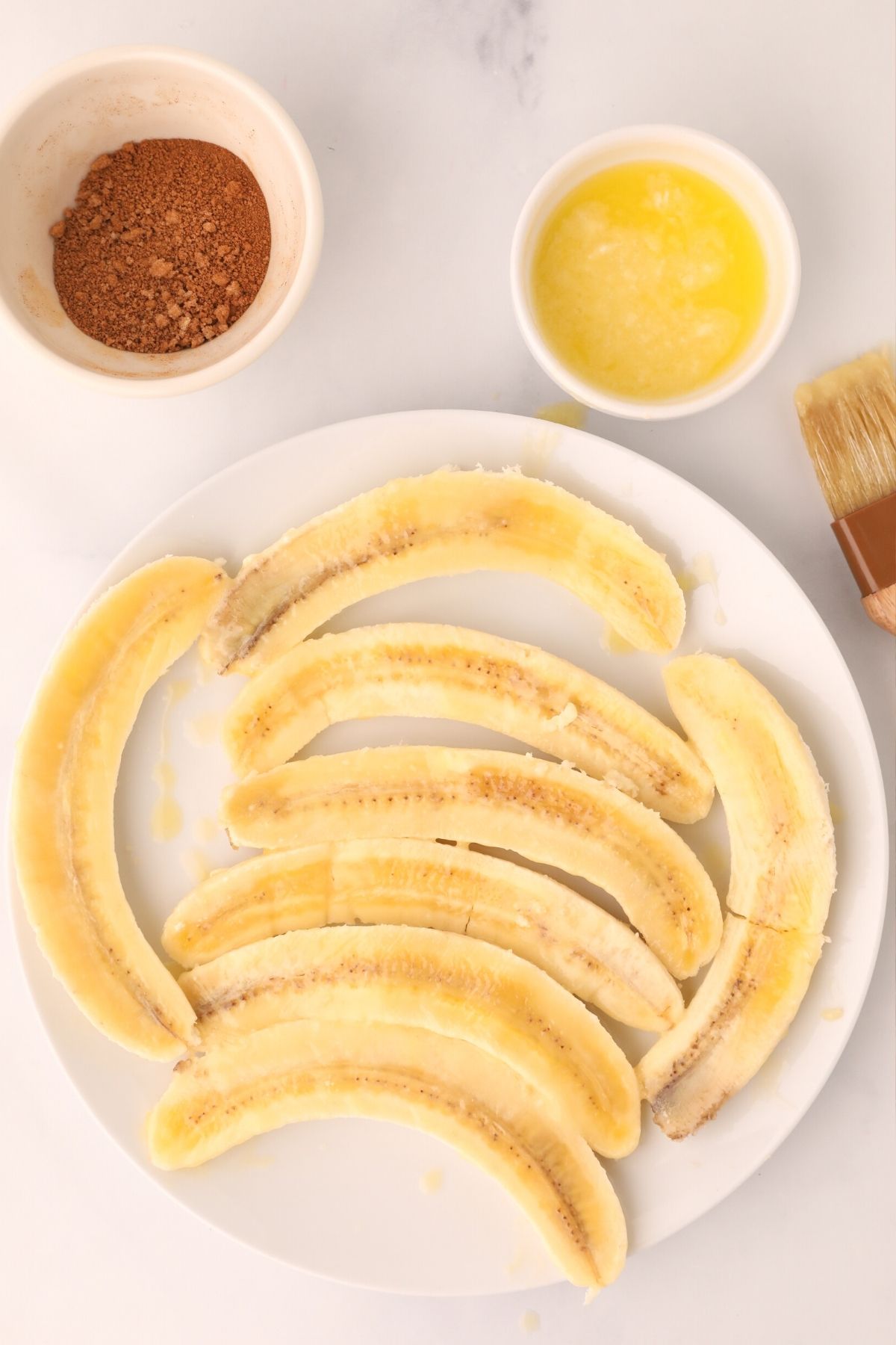 Peel and sliced bnanas brushed with melted butter
