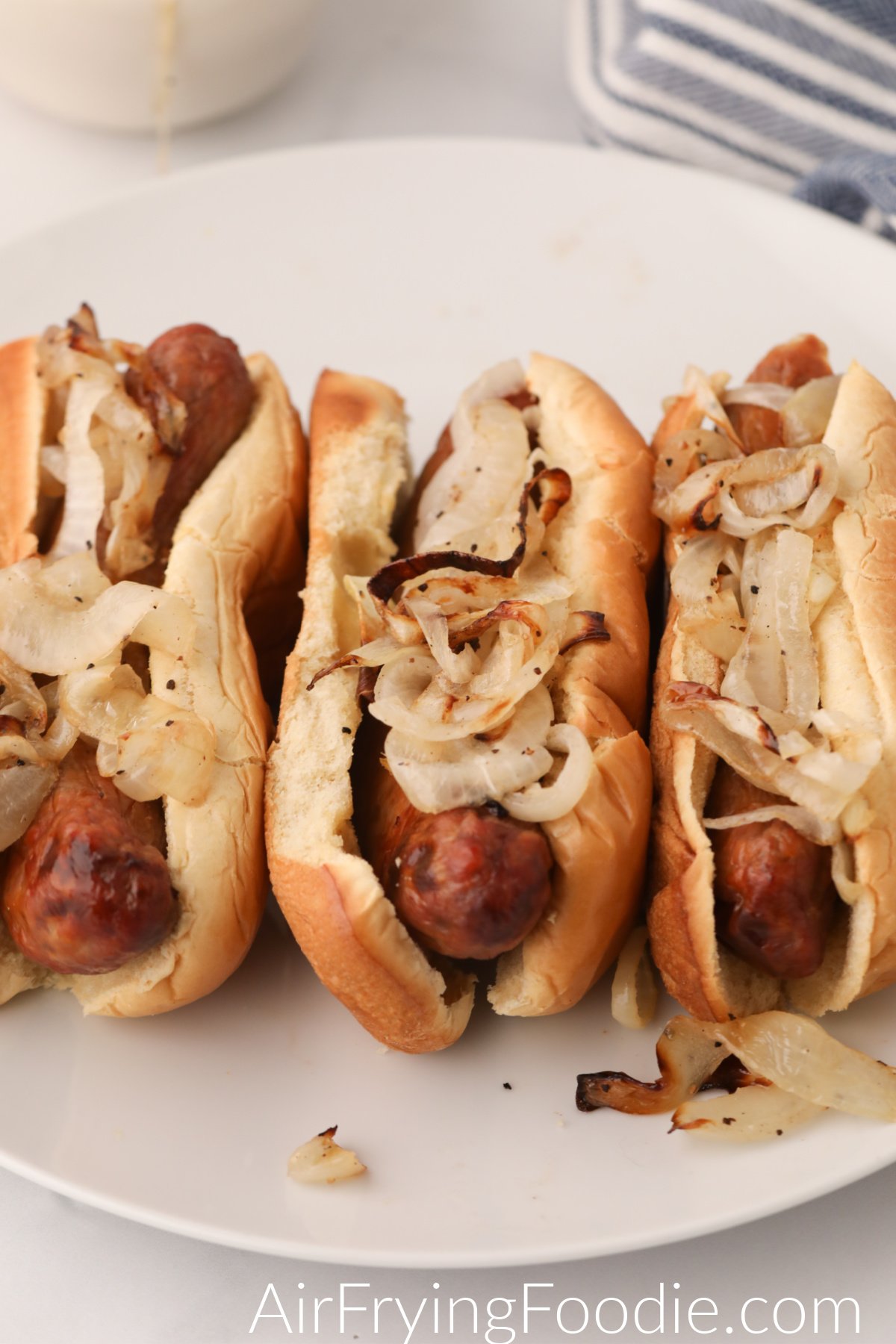 Air Fried onions served on sausages in buns and ready to serve.