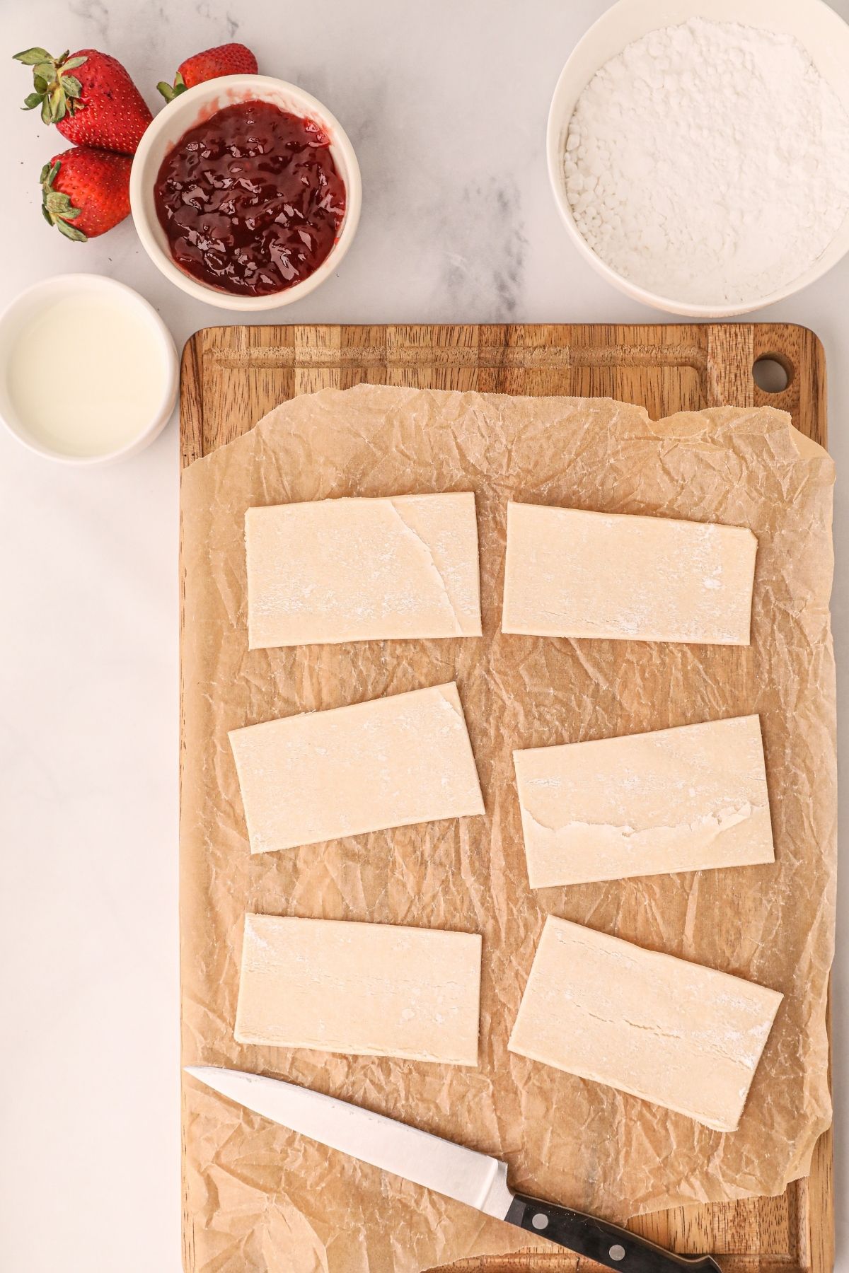 Pastry cut into rectangles before being filled with jam