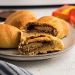 Close up picture of peanut butter cups wrapped in crescent roll dough cooked in the air fryer