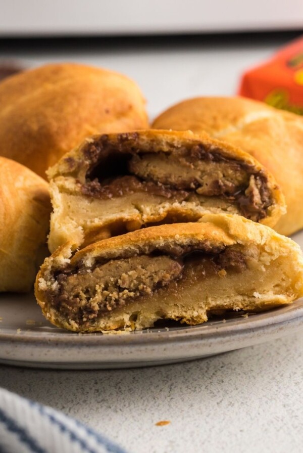 Close up picture of peanut butter cups wrapped in crescent roll dough cooked in the air fryer