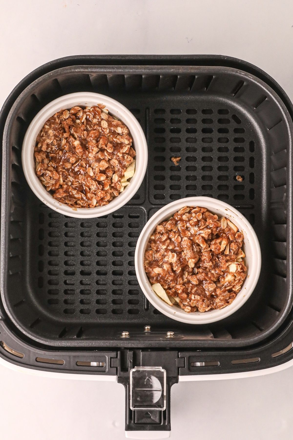 Apple crisp bowls after being cooked in the air fryer